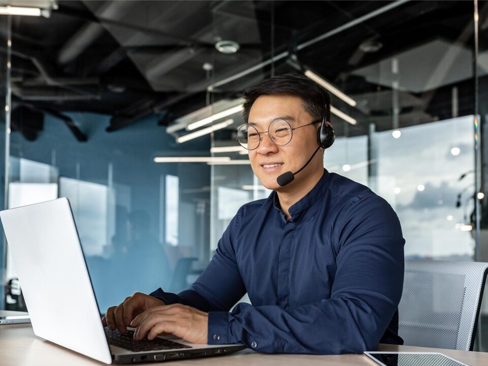 Image of a business person talking on a headset