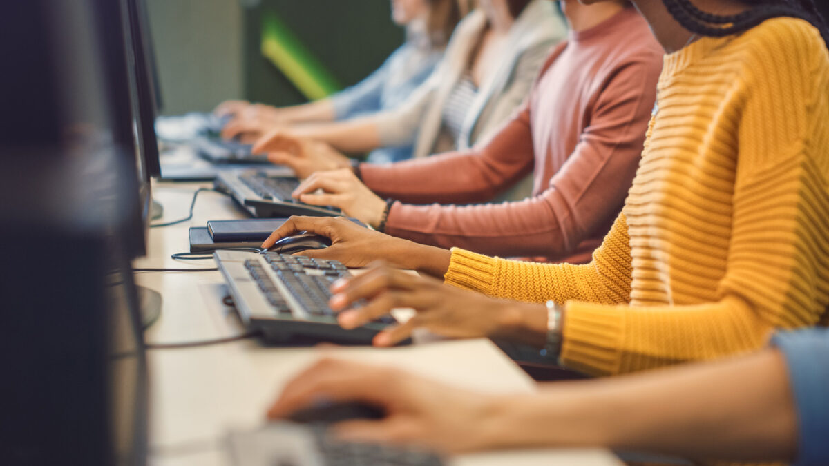 Office Team of Technical Support Staff Members Work on Computers