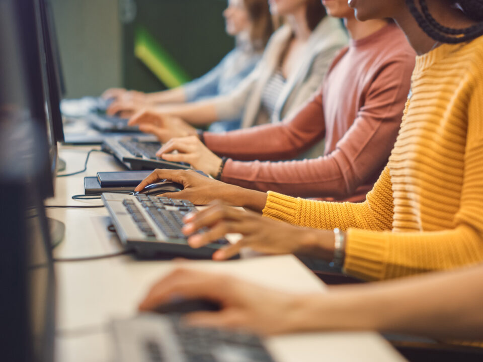 Office Team of Technical Support Staff Members Work on Computers