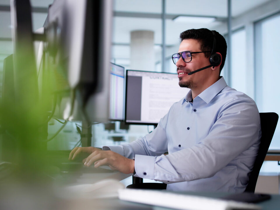 Hispanic customer support agent on phone call